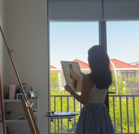 Framed 30x40 cm Ru Em oil painting hanging in a quiet Japandi reading nook
